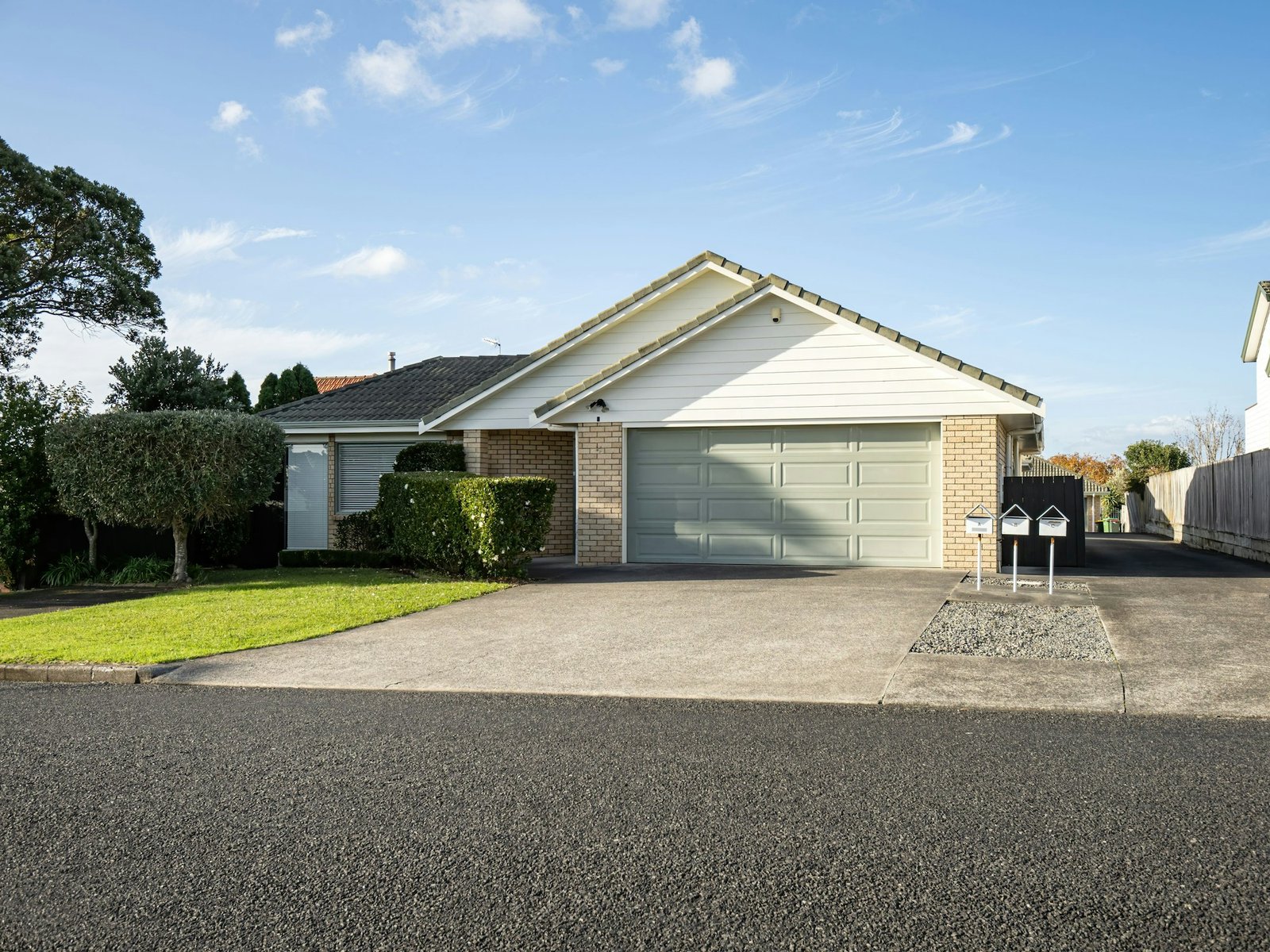 suburban garage with roller door under gabled roof