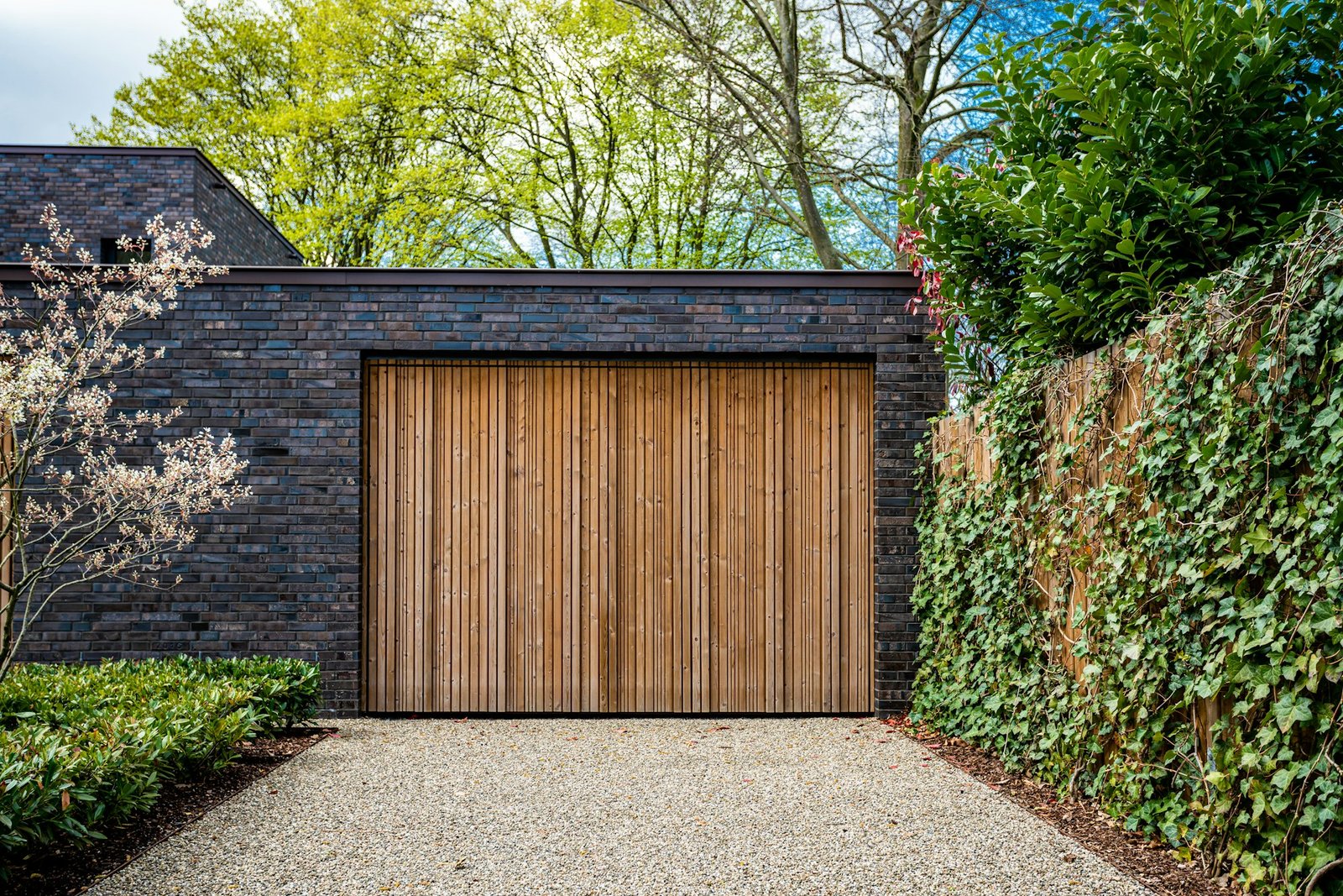 wide garage door and concrete driveway in front